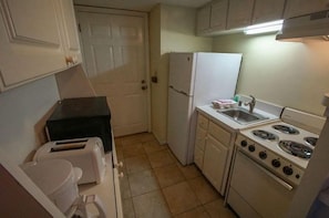 Cook up your favorite meals in the efficient kitchenette, complete with essential appliances, making your beachfront getaway both convenient and enjoyable.