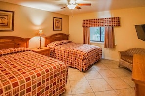 The guest bedroom features two full beds, ideal for family and friends to relax comfortably during their stay.