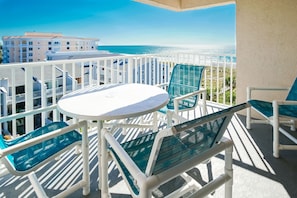 Enjoy breathtaking ocean views and relaxing moments on your private balcony at Sand Pebble, Treasure Island, FL.