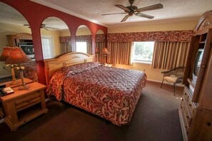 The spacious bedroom provides a serene retreat with a comfortable bed and ample natural light, ensuring restful nights during your stay.