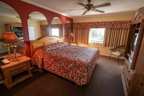 The spacious bedroom provides a serene retreat with a comfortable bed and ample natural light, ensuring restful nights during your stay.