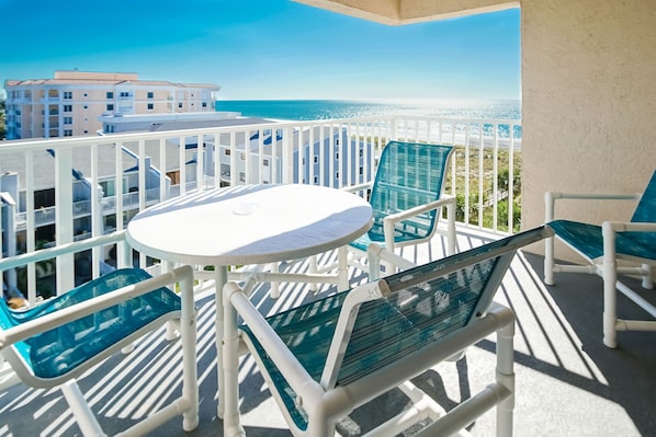 Enjoy breathtaking views from the side Gulf view balcony, equipped with comfortable seating for relaxing sunsets and coastal breezes.