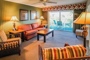 Relax in the beautifully styled living area that features a queen sleeper sofa and smart TV, ideal for family gatherings.