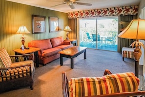 Relax in the beautifully styled living area that features a queen sleeper sofa and smart TV, ideal for family gatherings.