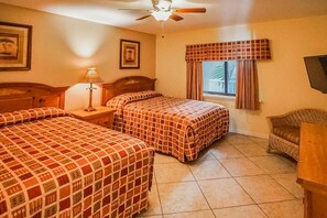 Two full beds in a cozy room provide ample space for family or friends, ensuring a restful night’s sleep.