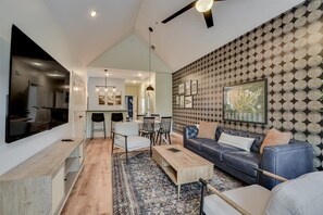 As you step into this charming retreat, you'll be greeted by a spacious, open floor plan that seamlessly blends the living, dining, and kitchen areas. 