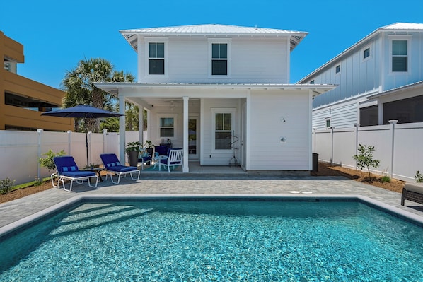 Stunning poolside view of your beach getaway—relax in your private oasis!