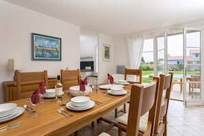 Enjoy meals at the dining table with seating.