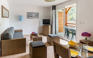 Relax and unwind in the cozy and open-plan living area.
