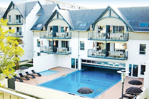 Lounge by the pool in the sunshine.