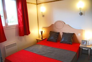 The master bedroom features a cozy Double bed.