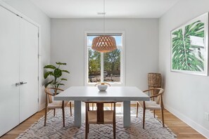 Spacious Kitchen Island with seating for 4 and Dining room table that can seat 4 more people for a delicious meal.