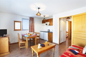 The living area is bright and cozy, perfect for relaxing after a wonderful day.