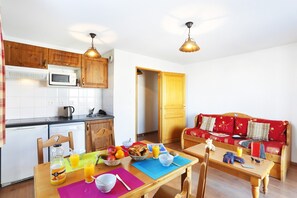 Prepare meals in the kitchenette and enjoy them at the dining table.
