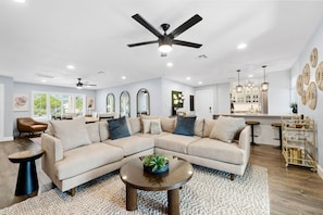 Kick back in this cozy, open living room—perfect for movie nights, cocktails, or just relaxing with friends.