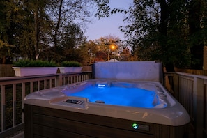 Can I get a hot tub? Why YES, YES YOU CAN! This beautiful new hot tub has room for 6 adults, complete with high power jets, mood lights and a waterfall!