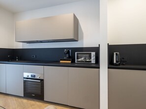 Kitchen, Kitchen Appliance, Interior Design, Countertop, Major Appliance, Cabinetry, Home Appliance, Kitchen Stove, Furniture, Lighting