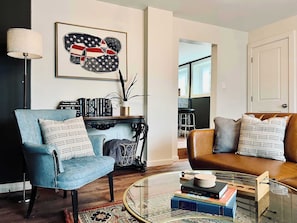 LIVING ROOM | FIRST FLOOR: The living room is just one step down from the kitchen.