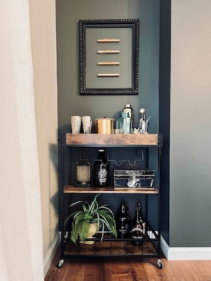 LIVING ROOM | FIRST FLOOR: Enjoy our bar cart, which includes all the tools you need to craft your perfect cocktail (alcohol & mixers not included).