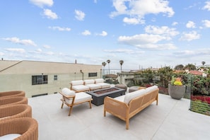Beautiful Ocean view deck with fire pit and plenty of lounging!