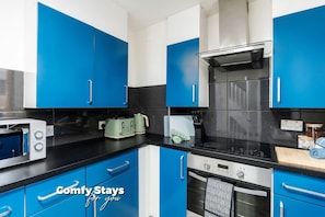 Kitchen in Blue with Everything You Need to Prepare Tasteful Meals