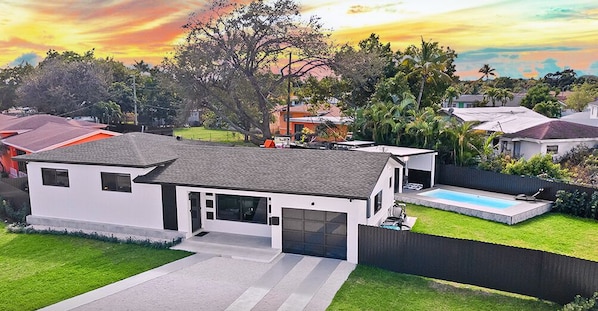 Experience a nature-filled entrance as you arrive, with lush surroundings.