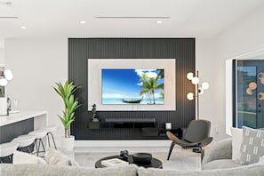 A large flat-screen TV sits comfortably in the room.