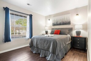 The luxurious queen bedroom includes a smart TV & ensuite bath