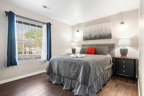 The luxurious queen bedroom includes a smart TV & ensuite bath