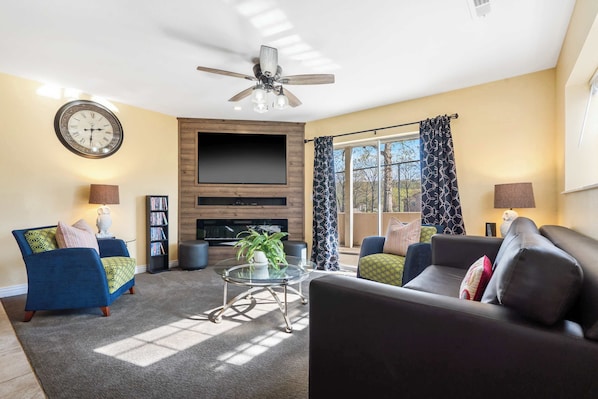 Unwind by the fireplace & stream your favorites on the living room smart TV