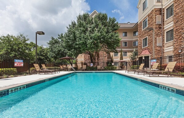 Dive into the outdoor pool on a hot summer day.