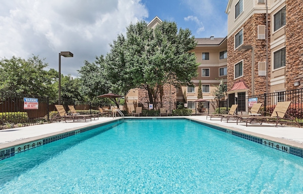 Dive into the outdoor pool on a hot summer day.
