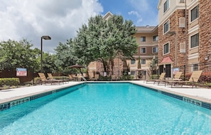 Dive into the outdoor pool on a hot summer day.