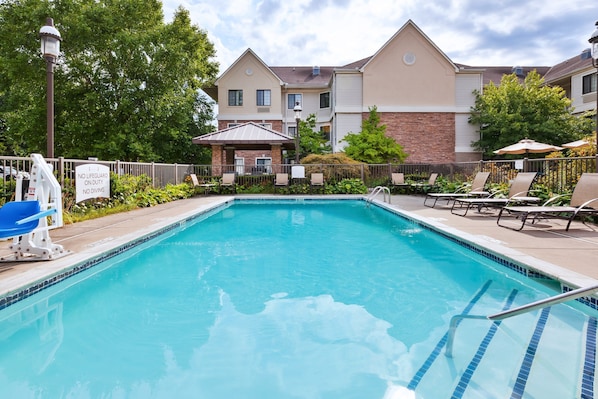 Lounge by the pool in the sunshine.