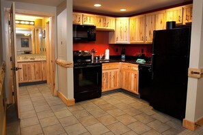 Prepare delicious homemade meals in the beautiful wood-furnished kitchen