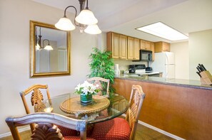 Enjoy your meals at the dining table with seating.