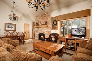 Take a seat in the comfortable living area, complete with cozy fireplace.
