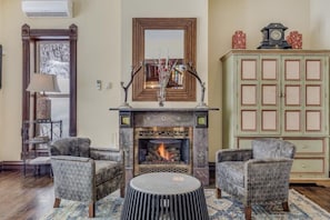 Main living room: Original Tiffany fireplace makes a stunning centerpiece