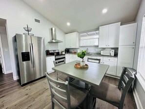 Cook up a storm in our open-concept kitchen, fully stocked with everything you need! With ample counter space and modern appliances, it’s perfect for preparing meals while staying connected with family and friends.