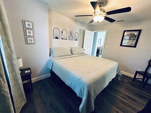 Unwind in this cozy master bedroom with a plush king-size bed, soft linens, and warm, inviting decor. The peaceful ambiance and comfortable space make it the perfect retreat for a restful, dreamy stay.