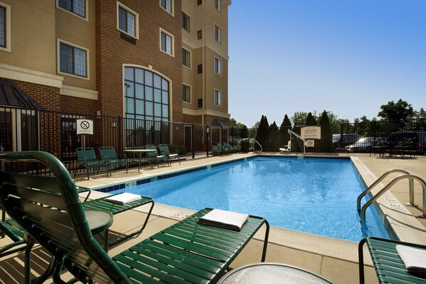 Lounge by the pool in the sunshine.