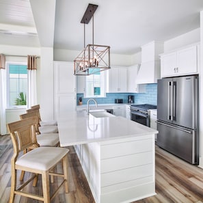 If you love to cook, this is the home for you! The spacious kitchen features plenty of counter space, a large refrigerator and freezer, a 36-inch gas range, and more!