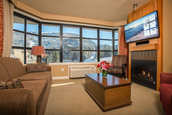 Relax in front of the fireplace in your cozy and deluxe unit!