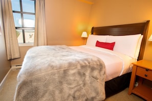 The luxe master bedroom features a split-King bed.