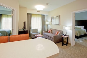 Find peace and relaxation with your close friends and family in this stunning living room featuring natural decor.