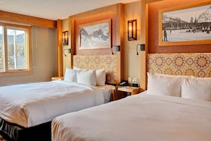Drift to sleep in the 2 Queen beds with luxe bedding.