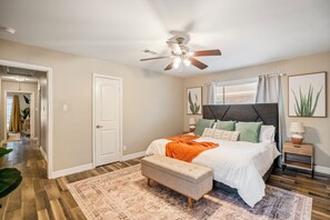 Relax in a cozy, stylish bedroom with plush bedding and modern decor.
