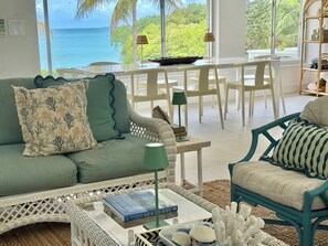 Turquoise sea views from the living room and dining room picture windows.
