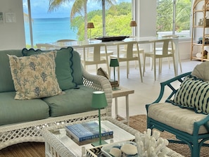 Turquoise sea views from the living room and dining room picture windows.