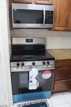 Fully equipped kitchen with stainless steel appliances